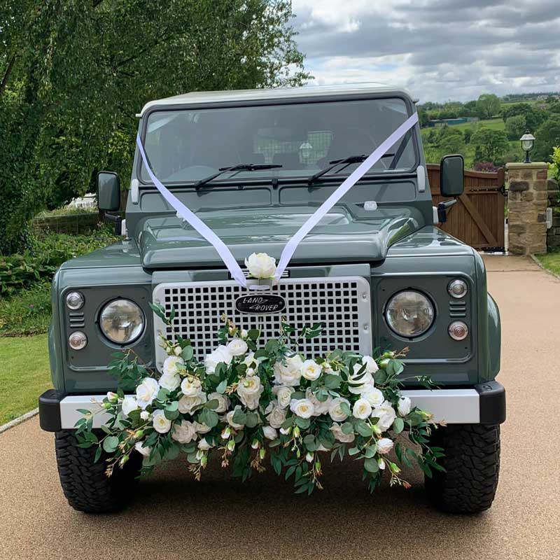defender-icon-wedding-car-with-flower-garland